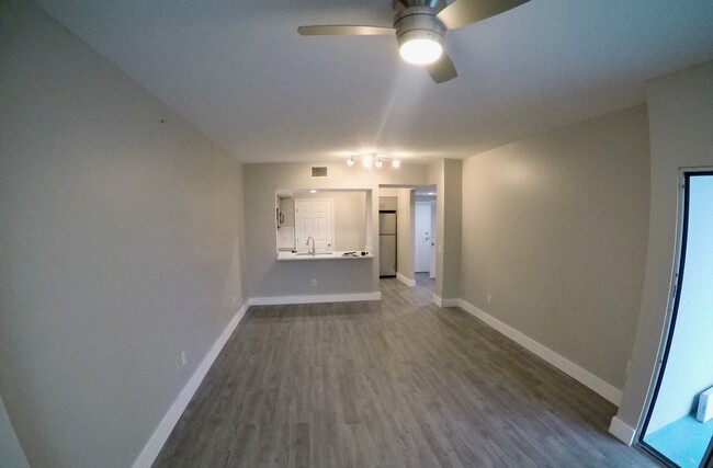 keep walking through the living room to the balcony - 322 E Central Blvd