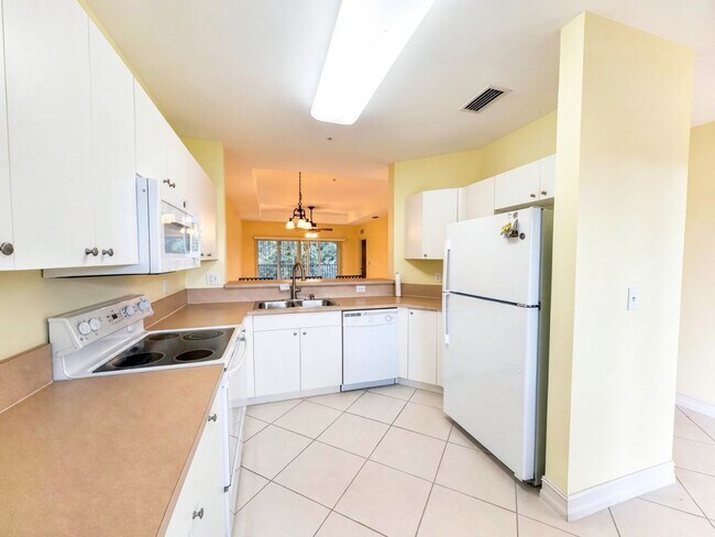 Building Photo - AVAILABLE NOW! Top-Floor Condo | Gated Community | Preserve Views | Water, Sewer & Cable Included