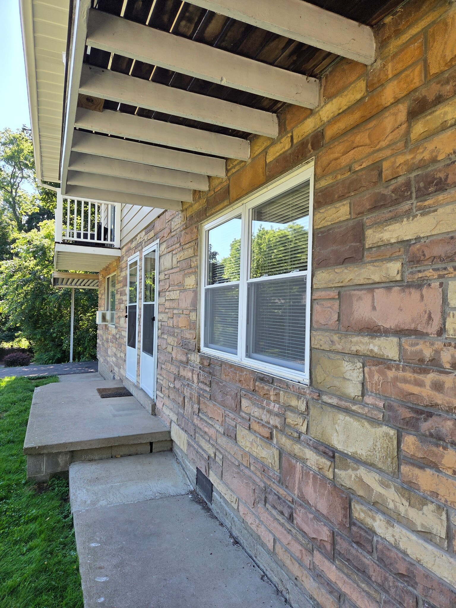 Front entry showing new living room windows. - 102 Stonecrest