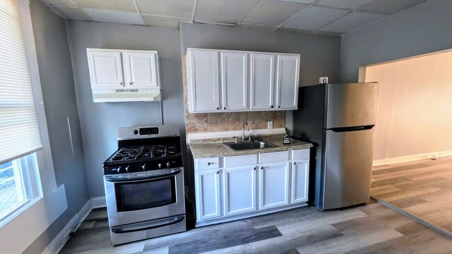 Building Photo - Beautiful Two Bedroom, Plus a Pass Through Room with a Fenced in Rear Patio