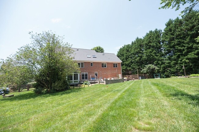 Building Photo - Spacious & Striking 3-story brick Executive 4 bedroom 4.5 bathroom home in Oak Ridge NC + Lawn ca...