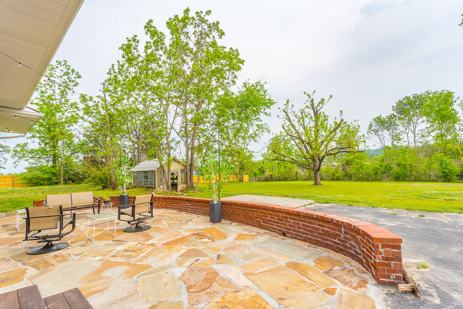 large stone patio (a wood deck has been constructed since this picture too) - 8011 Shallowford Rd