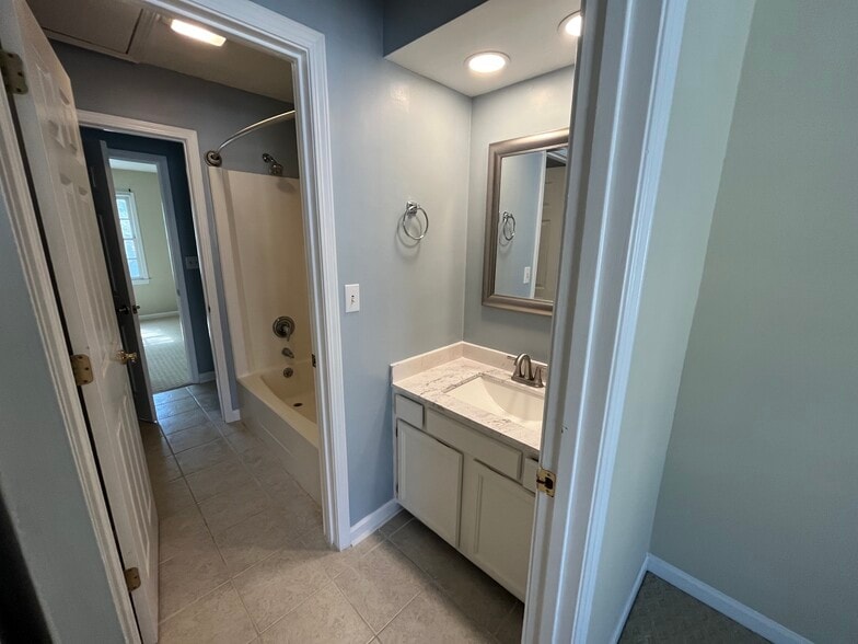 "His and Her" bathroom with shower/tub and two half baths - 830 44th Ave N
