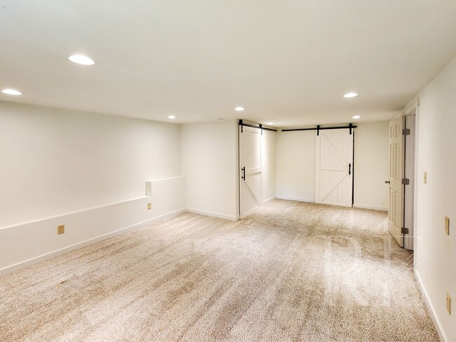 Building Photo - Vaulted Ceilings, Unique Designer Kitchen & Expansive Half-Acre Setting with Flexible Living Spaces