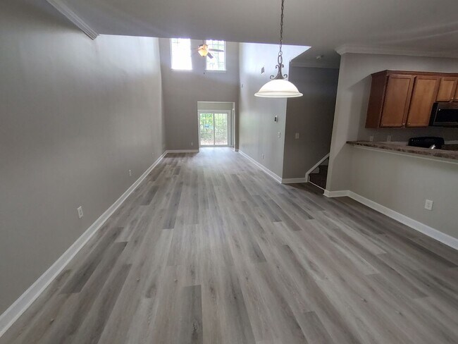Building Photo - BRAND NEW FLOORING & FRESH PAINT - 3 Bedroom/2.5 Bath Townhome with garage in Wild Wing!