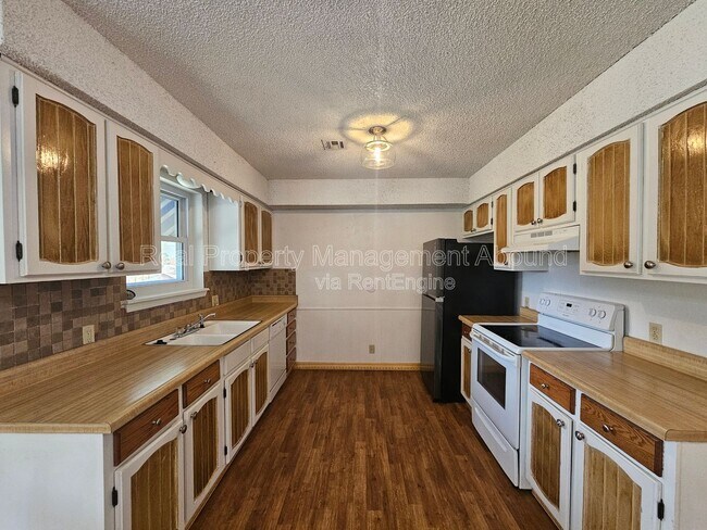 Building Photo - 7710 N 120th Ave E