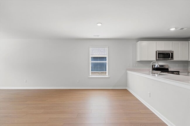 Building Photo - New 3BR Home in Whispering Woods – Modern ...