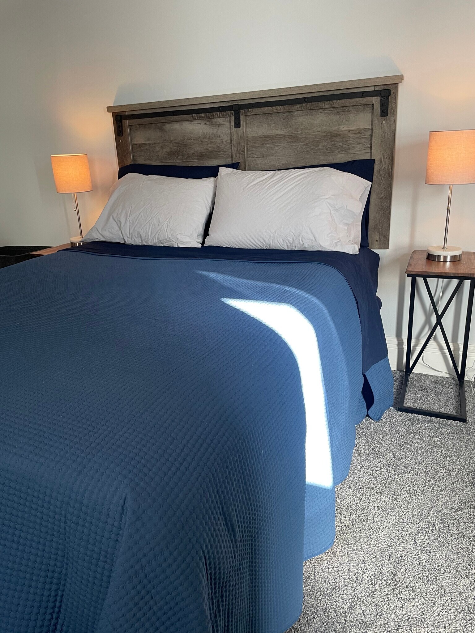 Queen sized bed in primary bedroom. - 28 Saint James Pl