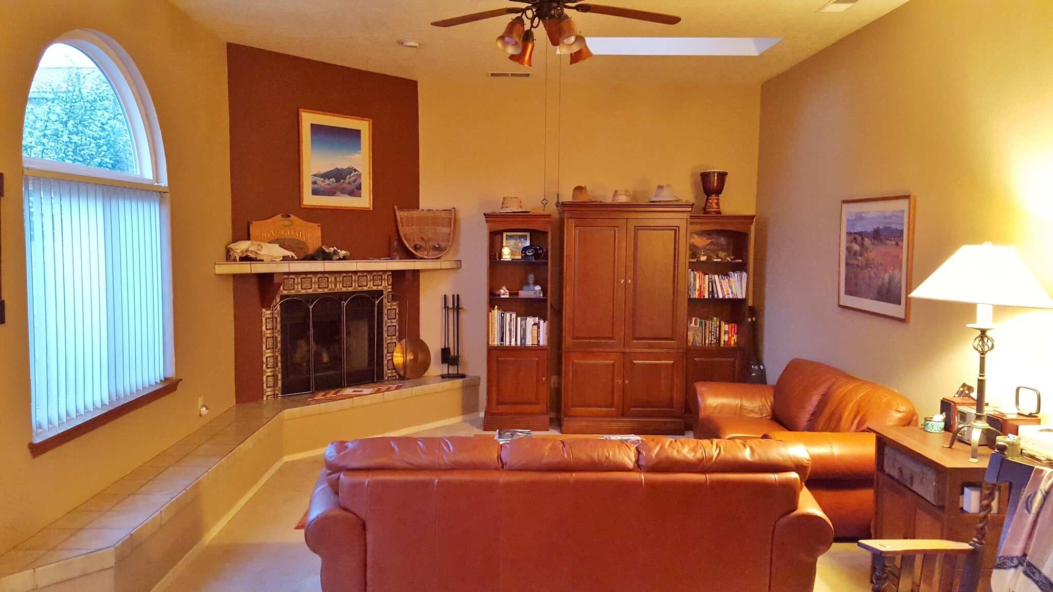 This is the living room with banco under the window. Very sunny and light with skylights. - 6436 Saint Josephs Ave NW