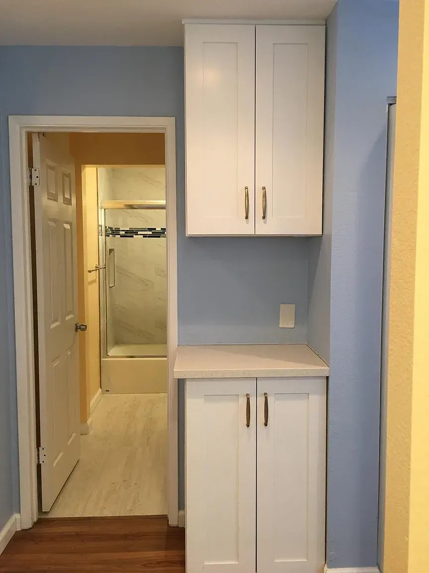 New cabinets outside newly remodeled hallway bathroom - 5318 Borneo Cir