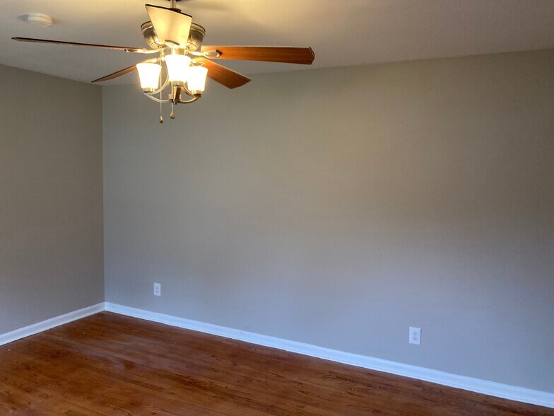 Living room and bedrooms with beautiful hardwood flooring - 5200 Peppercorn St