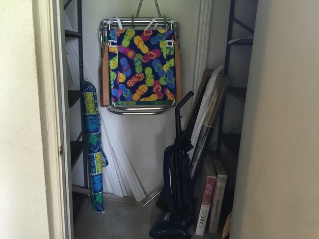 beach chairs in patio closet - 123 Deer Creek Blvd