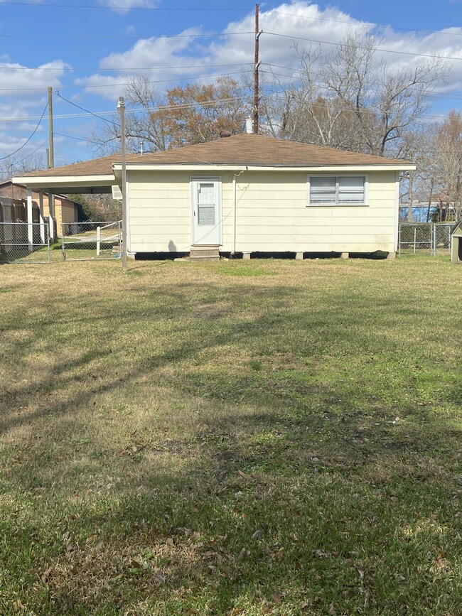 Back of house with large fenced backyard. - 2975 Pecos St