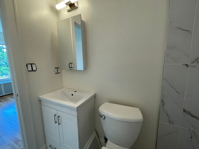 Building Photo - Brand New Renovation! 3 BR/ 2 BA On Quiet ...