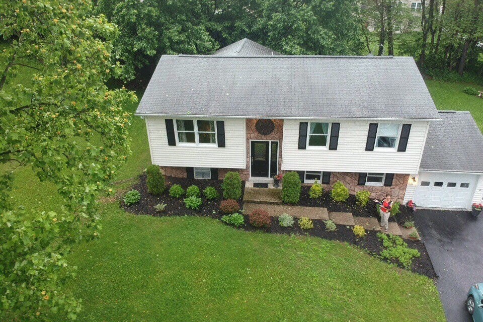 Drone view. New shingles with trimmed trees. - 7288 Beechtree Ct