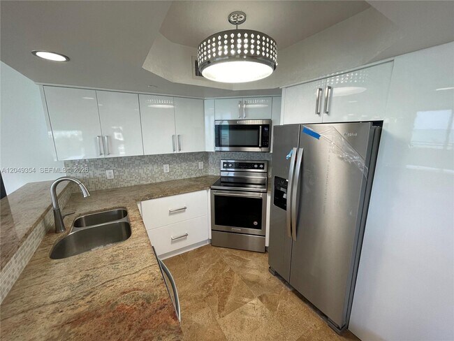Building Photo - 8911 Collins Ave