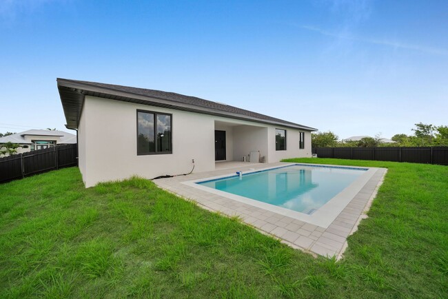 Building Photo - Brand-New Pool Home for Rent – Port Charlo...