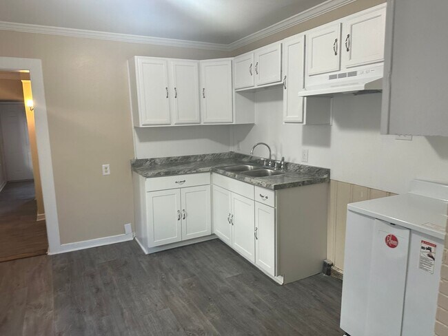 Building Photo - Coming Soon! Four-Bedroom Bungalow with Fe...