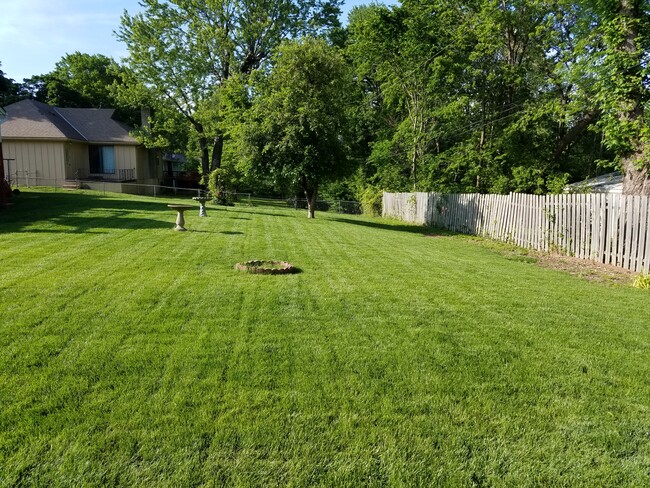 Backyard is fenced in. - 11009 Elmwood Ave