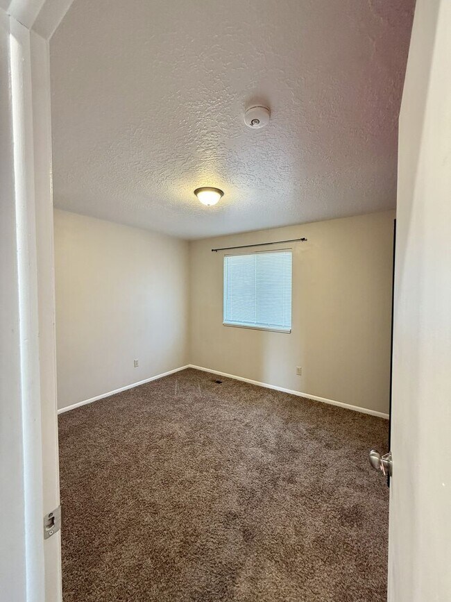 Building Photo - Spacious Comfort Meets Practical Living in...
