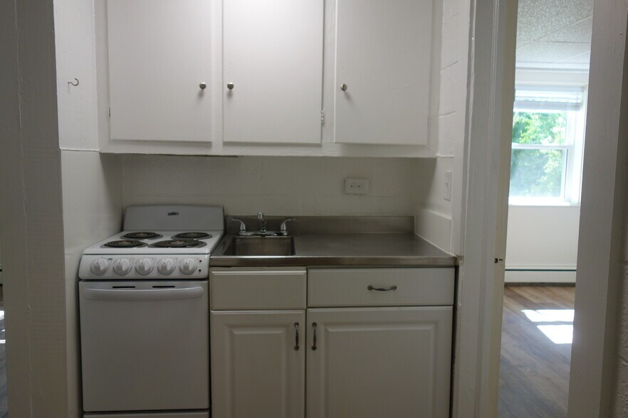 New stove and stainless sinktop. - 116 Howard Dr