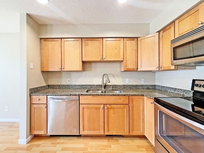 Building Photo - Beautifully Redone Modern Townhome with Large Deck, 2-Car Garage, Granite Kitchen, Vaulted Ceilin...