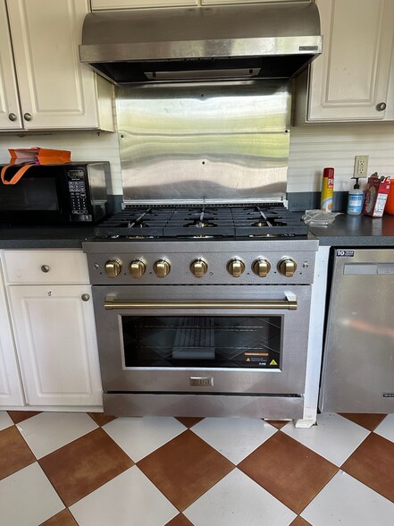 Six burner gourmet gas stove - 7927 Oak St