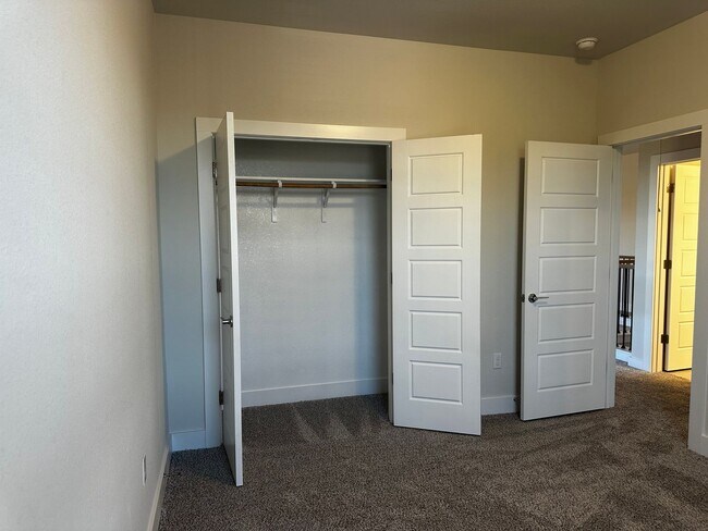 Building Photo - For Lease – Modern 2023 Condo Backing to Greenbelt | Creekside at Pioneer Crossing West