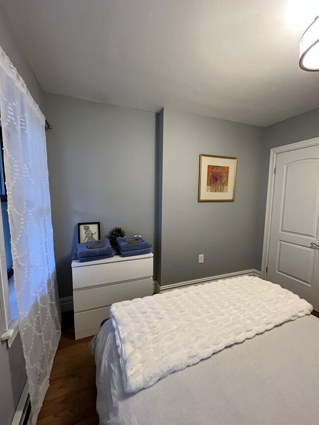 Master bedroom with closet and dresser - 192 Hart St