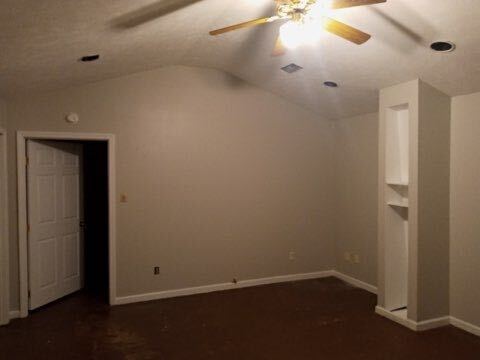 Bedroom with fan, walk-in closet, and vaulted ceiling - 140 Lemmon Drive