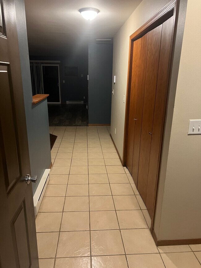 Walking in from garage. Laundry closet on right. - 935 Shamrock Ct