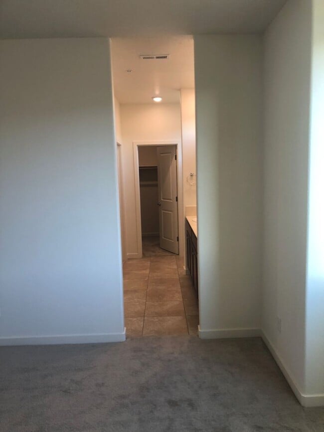 Building Photo - CORNER LOT - END UNIT - NO YARD TO MAINTAIN - GRANITE - STAINLESS - GATED