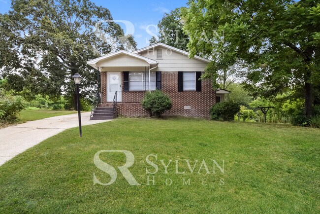 Building Photo - Welcome to this charming abode.