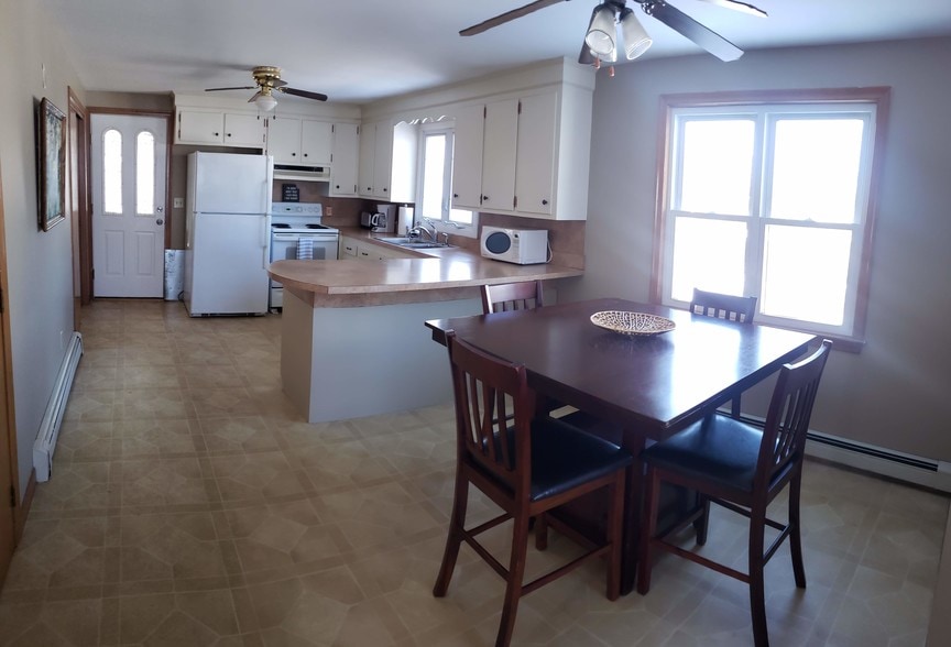 Dining area looking into kitchen - 91 S Hall St
