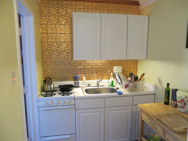 Kitchen with Copper Backsplash and gas stove - 1818 Pleasant St