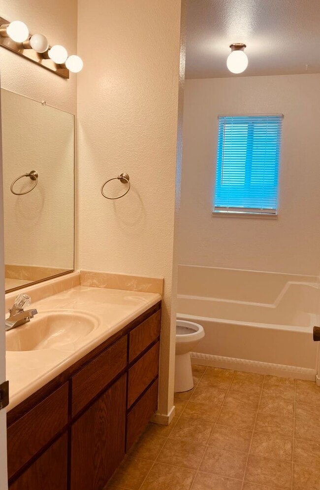 Building Photo - Spacious 2 Bedroom/2 bath duplex with a 2 car garage and laundry hook ups in a great North Modest...