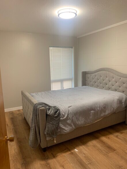Bedroom 1 queen sized bed with bedframe and dresser - 886 Raymond Dr
