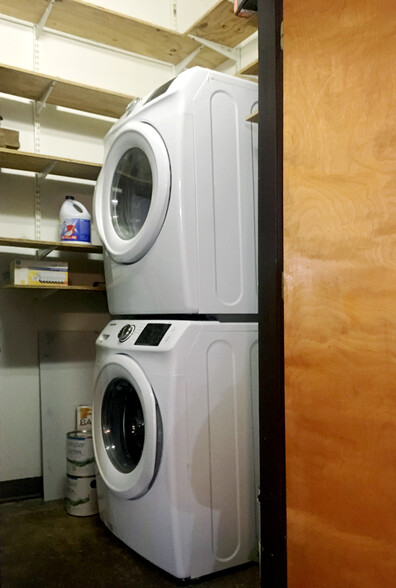 Laundry room with energy efficient stackable units. - 659 Auburn Ave NE #145