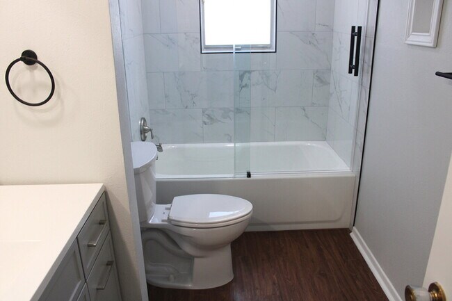 Building Photo - "Charming, Bedford home with Dual Living Spaces, Bonus Room, and a Spacious Backyard!"