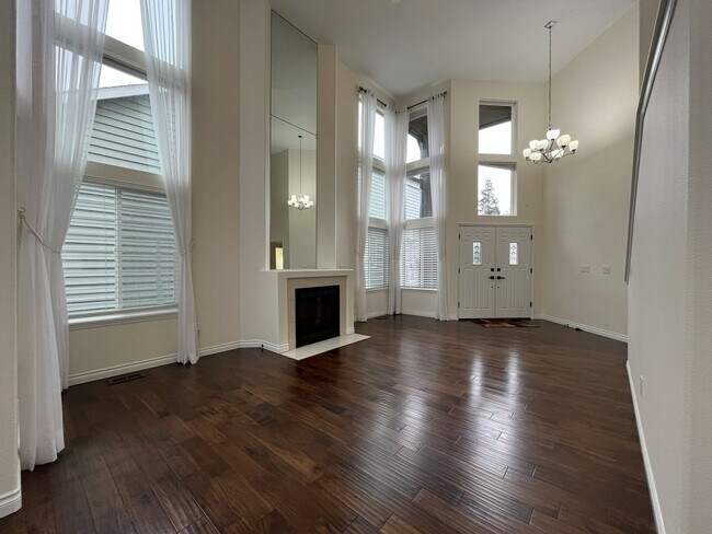 Building Photo - Grand 5 Bedroom Home Featuring 19ft Ceilings, Family Room & Main-Level Suite