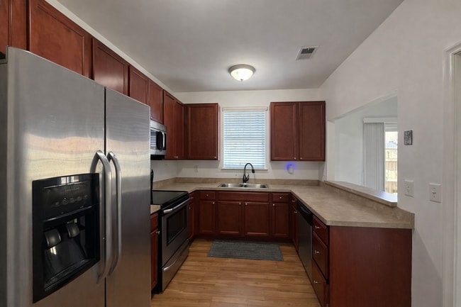 Building Photo - Spacious End-Unit Condo with Dual Primary Suites & Bonus Room