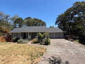Building Photo - Spacious 4BR/3BA Home with Deck, Fenced Yard & Garage