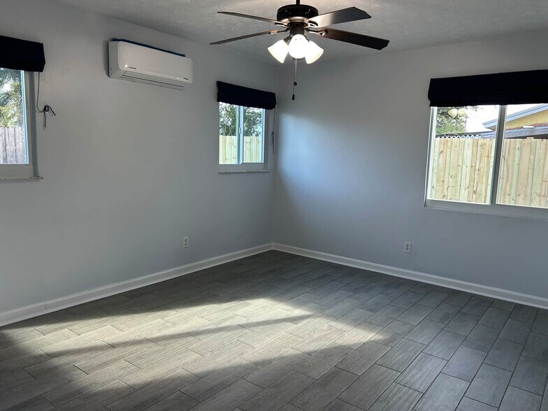 Master bedroom with its own mini split AC unit for perfect comfort all night - 7669 SE James St