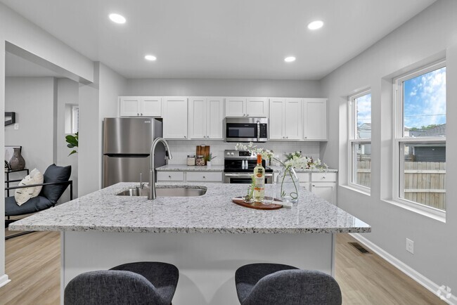 Gourmet, luxury granite countertops kitchen with stainless steel appliances - 185 N Harris Ave