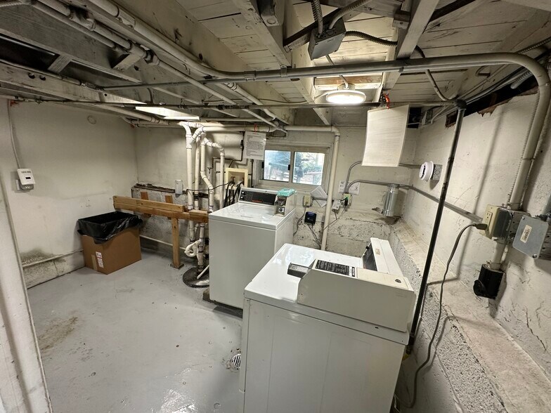 Laundry area in basement - 926 E St Charles Rd