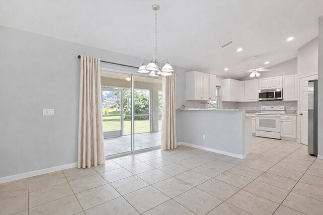 Building Photo - Spacious Three-Bedroom Home with Open Floor Plan, Large Yard & Screened Patio