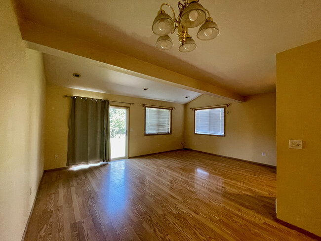 Living/dining area as seen from kitchen - 290 NW Clay Ct