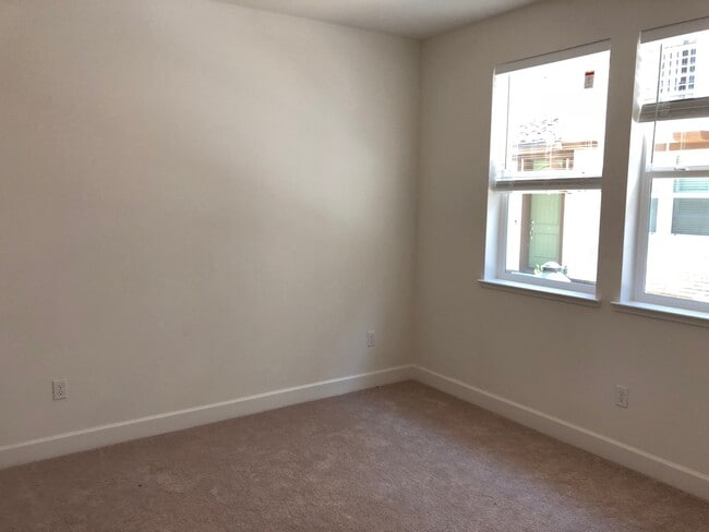 Building Photo - Tri-level Townhome with 2 Car Attached Gar...
