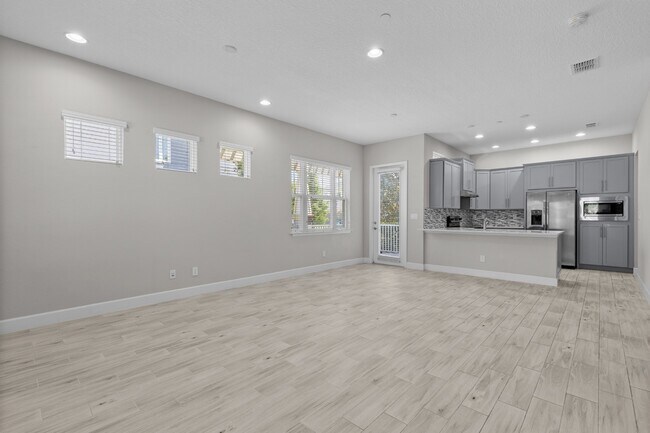 Building Photo - Move In Ready End Unit Townhome in Laureate Park | 3 Bed | Tesla Charger