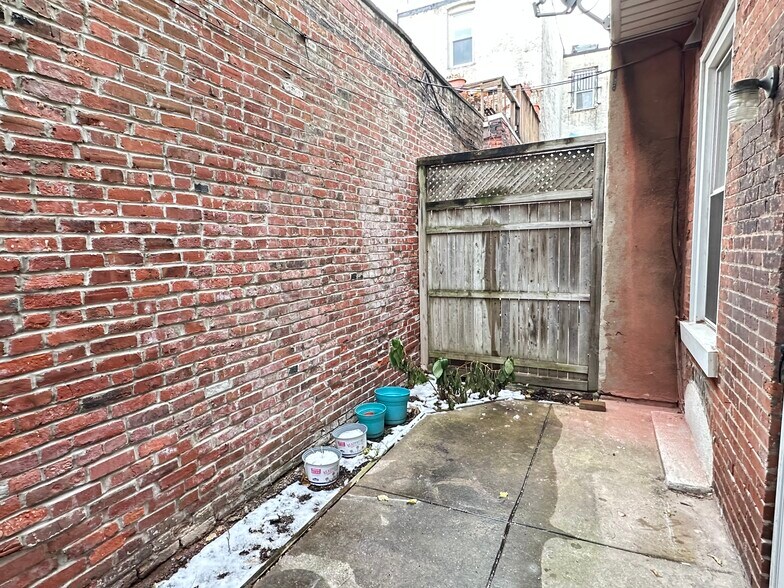 The backyard is gray in the winter, but is a blank canvas for you to get it ready for spring blooms. - 336 Fitzwater St